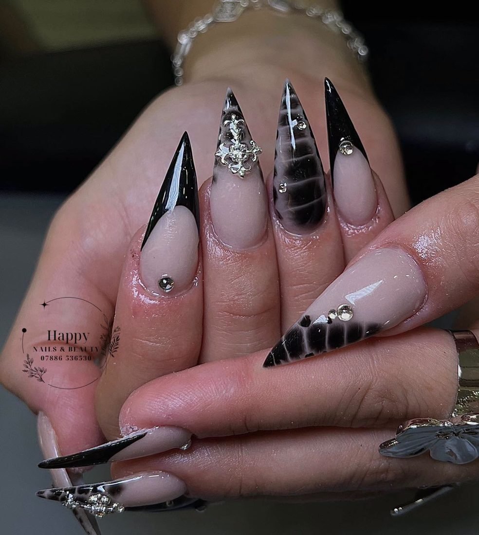 Black French tip stiletto nails with snakeskin accents