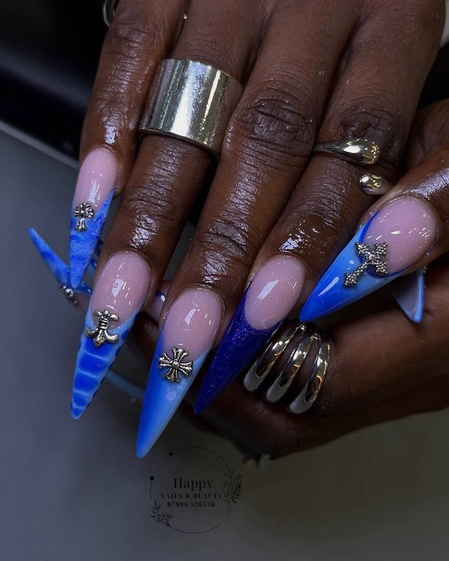 Cobalt stiletto nails with silver cross charms