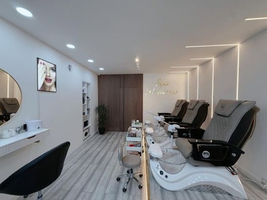 Pedicure chairs and basins inside the salon